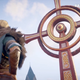 Eivor looks up at a cross in Assassin's Creed Valhalla: The Last Chapter